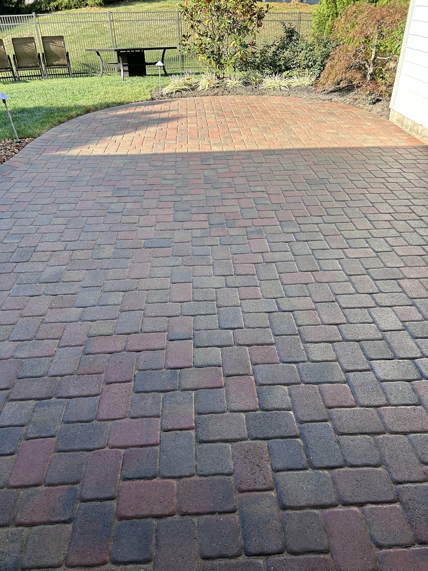 Freshly sealed pavers after having failed sealer stripped